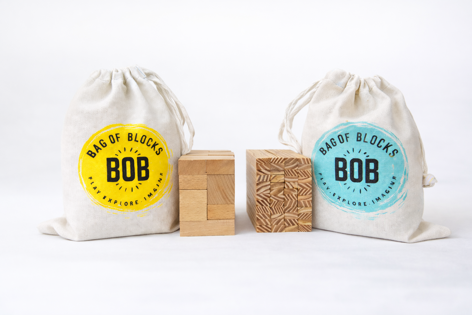 Two 'Bag of Blocks' bags with wooden blocks on a white background